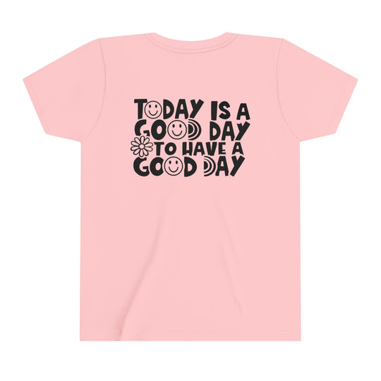 Youth short sleeve tee with Good Day to Have a Good Day text. Pink shirt with black text, smiley faces, and flower design. Lightweight, 100% cotton, tear-away label, retail fit. Sizes: S, M, L, XL.