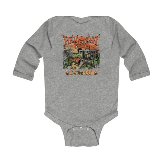 A baby bodysuit featuring a Halloween-themed design with a cartoon pumpkin and a house. Made of soft cotton for baby's comfort, with plastic snaps for easy changing. From Worlds Worst Tees.