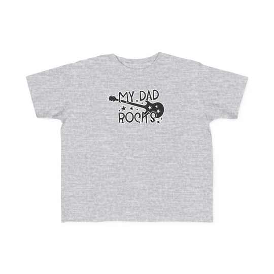My Dad Rocks Toddler Tee: A grey t-shirt with black text, perfect for sensitive skin. 100% combed ringspun cotton, light fabric, tear-away label. Ideal for first adventures. Sizes: 2T, 3T, 4T, 5-6T.