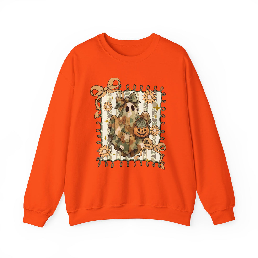Quilted Ghost Crew: Bright orange sweatshirt featuring a ghost in camouflage with a bow, holding a pumpkin bucket, framed by loops, ribbons, and daisy-like flowers.