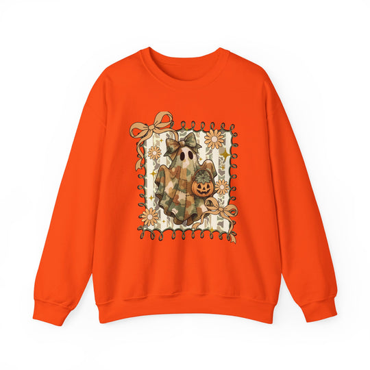 Quilted Ghost Crew: Bright orange sweatshirt featuring a ghost in camouflage with a bow, holding a pumpkin bucket, framed by loops, ribbons, and daisy-like flowers.