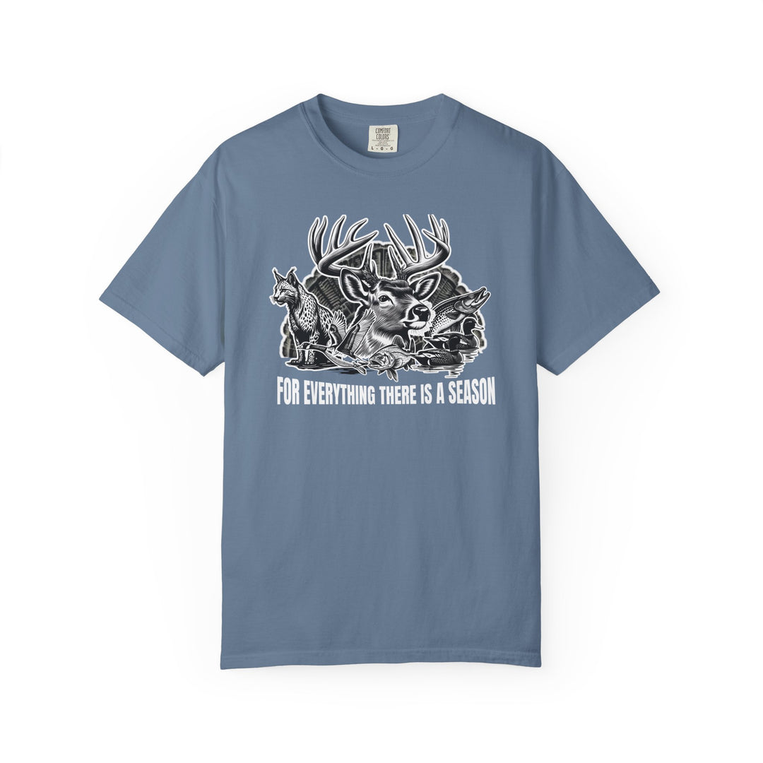 For Everything There is a Season Tee featuring a wildlife graphic with a buck, coyote, fish, and ducks, offering comfort and durability in various sizes.