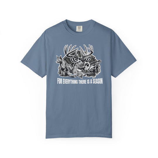 For Everything There is a Season Tee featuring a wildlife graphic with a buck, coyote, fish, and ducks, offering comfort and durability in various sizes.