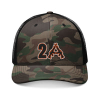 Camo-patterned trucker hat with mesh back and embroidered 2A logo featuring crossed rifles, combining style and functionality for a comfortable, adjustable fit.