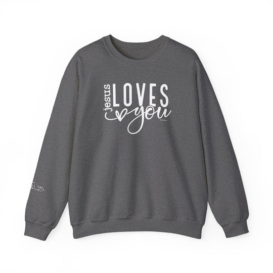 Unisex heavy blend crewneck sweatshirt featuring Jesus Loves You text. Made of 50% cotton and 50% polyester, ribbed knit collar, double-needle stitching for durability, tear-away label for comfort. Ideal for colder months.