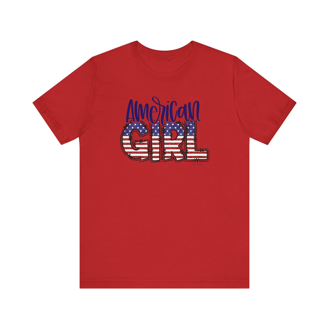 American Girl Tee: Red shirt with flag and text designs. Unisex jersey tee with ribbed knit collar, 100% cotton, retail fit, tear away label. Sizes XS-3XL. Soft, quality fabric for a loved favorite.