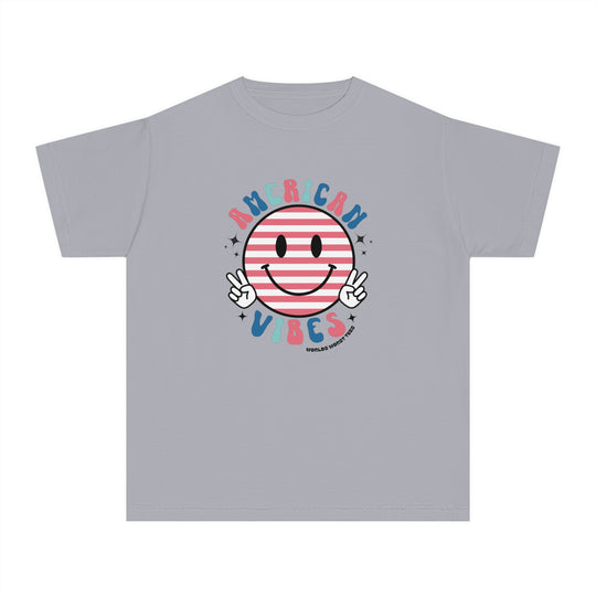 American Vibes Youth Tee: A grey t-shirt featuring a smiley face design, perfect for active kids. 100% combed ringspun cotton, soft-washed, and garment-dyed for comfort. Classic fit for all-day wear.