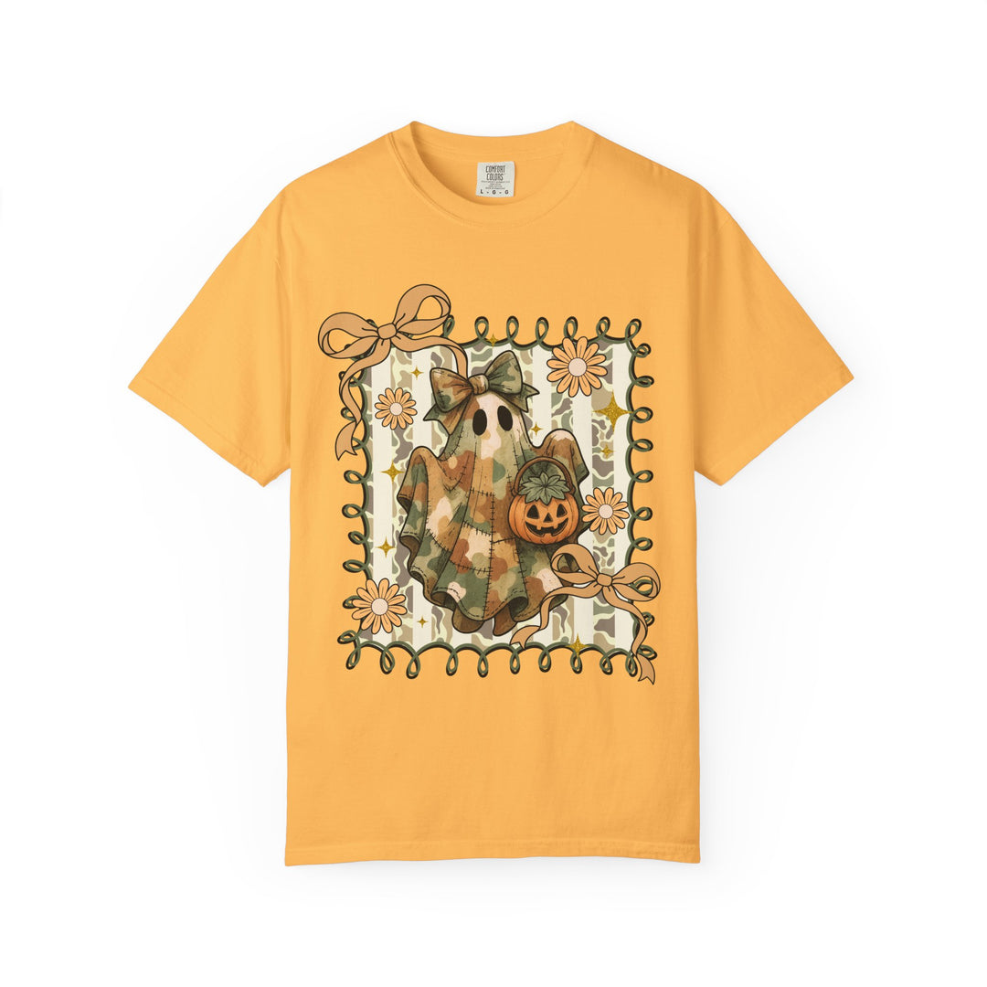 Quilted Ghost Tee features a camouflage-style ghost with a jack-o-lantern on a yellow-gold Comfort Colors T-shirt, bordered by vines and flowers.