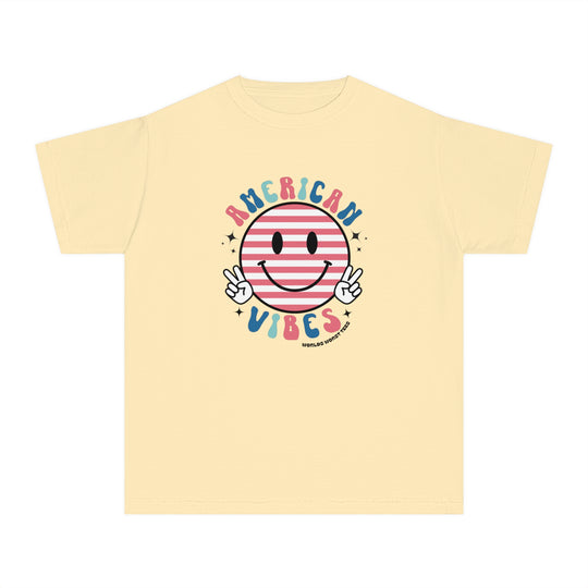 American Vibes Youth Tee: A yellow t-shirt featuring a smiley face and peace sign hands. Made of soft combed cotton for comfort and agility, perfect for kids on the go. Classic fit for all-day wear.