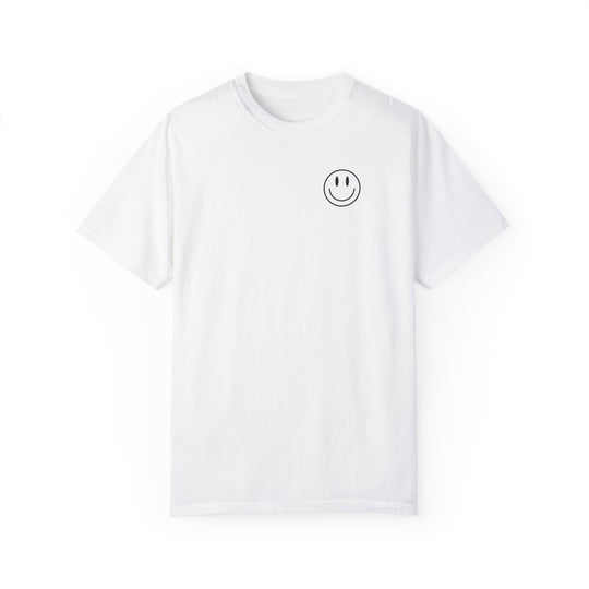 A white t-shirt featuring a smiley face graphic, the God Day to Have a Good Day Tee from Worlds Worst Tees. Made of 100% ring-spun cotton, garment-dyed for coziness, with a relaxed fit and durable double-needle stitching.