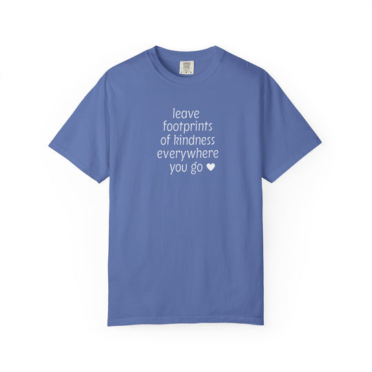 Leave Kindness Tee featuring a white hand-lettered quote about spreading kindness, printed on a cornflower-blue Comfort Colors short-sleeve shirt, laid flat.