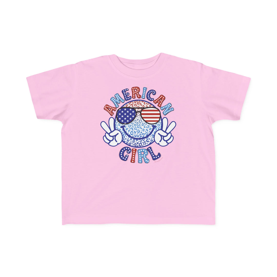 American Girl Toddler Tee featuring a pink shirt with a cartoon leopard and peace sign print. Soft 100% combed ringspun cotton, light fabric, tear-away label, and classic fit. Sizes: 2T, 3T, 4T, 5-6T.