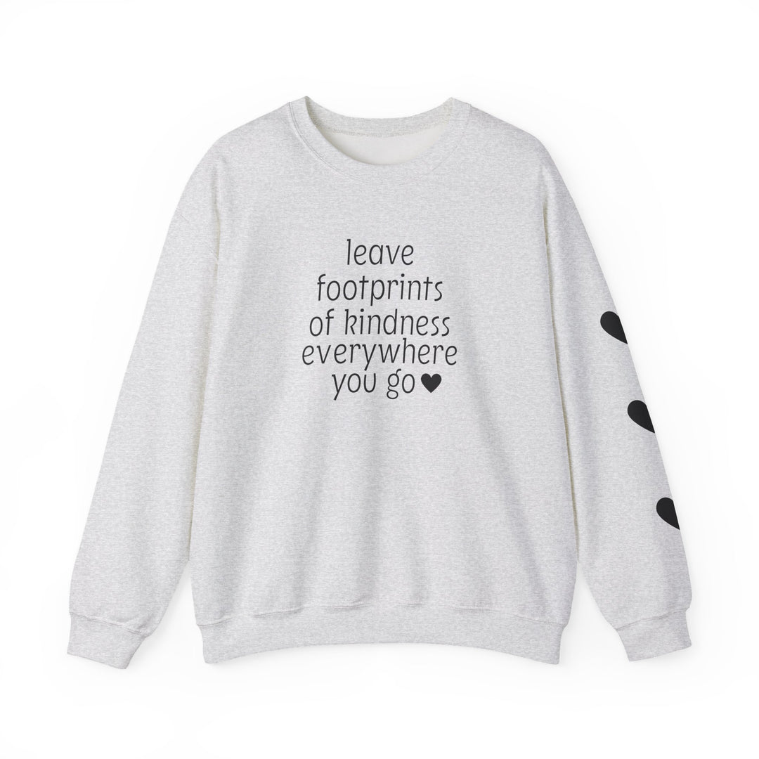 Light-gray crewneck sweatshirt with leave footprints of kindness everywhere you go ♥ in black letters, black heart shapes on the right sleeve.