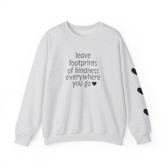 Light-gray crewneck sweatshirt with leave footprints of kindness everywhere you go ♥ in black letters, black heart shapes on the right sleeve.