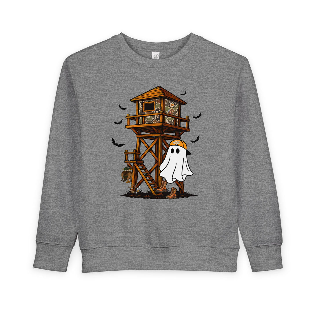Ghost Hunter Toddler Crew: Heather-gray sweatshirt with a Halloween-hunting graphic featuring a ghost in boots, hunting-blind, pumpkins, and bats, perfect for cozy toddler wear.