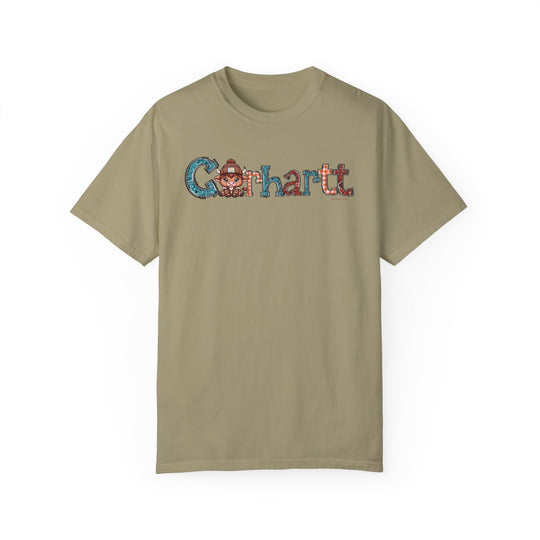 A tan Cowhartt Tee with a cartoon cow logo, crafted from 100% ring-spun cotton. Medium weight, relaxed fit, double-needle stitching for durability, and seamless design for a tubular shape.