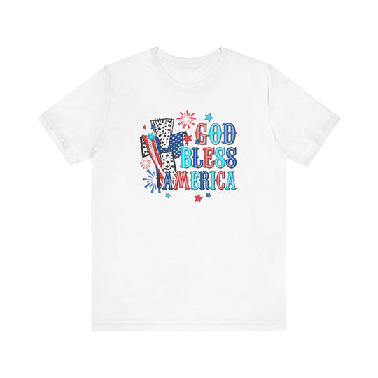 A classic white tee featuring red, white, and blue text with a cross and fireworks design. Made of 100% Airlume combed cotton, retail fit, tear away label, and ribbed knit collars for a comfortable fit.