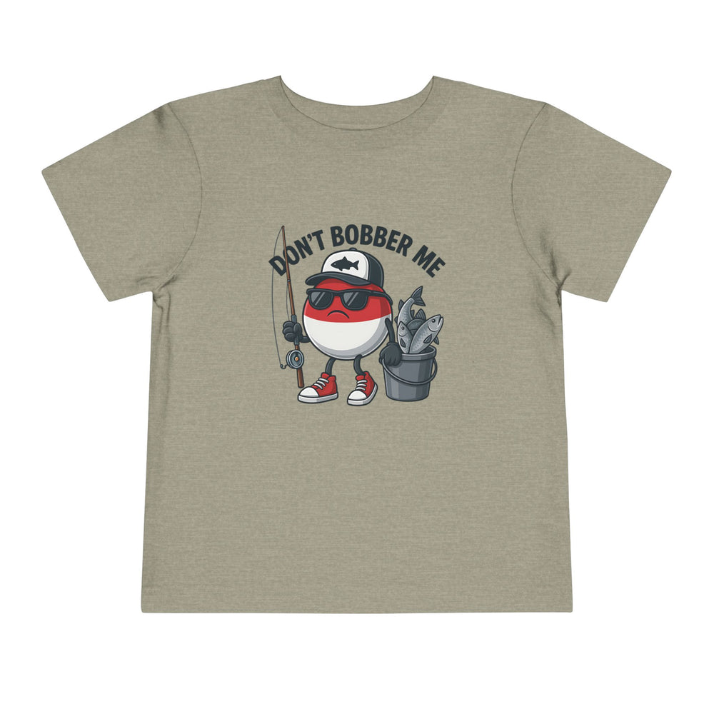 Don't Bobber Me Toddler Tee featuring a cartoon bobber character with sunglasses and fishing gear, crafted from soft cotton for comfort, perfect for kids' playful style.