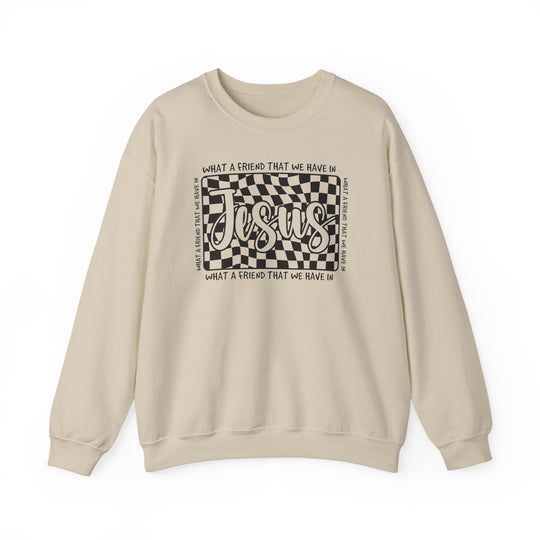 Cream-colored crewneck sweatshirt featuring a wavy checkerboard graphic with Jesus at the center, surrounded by What a friend that we have in.