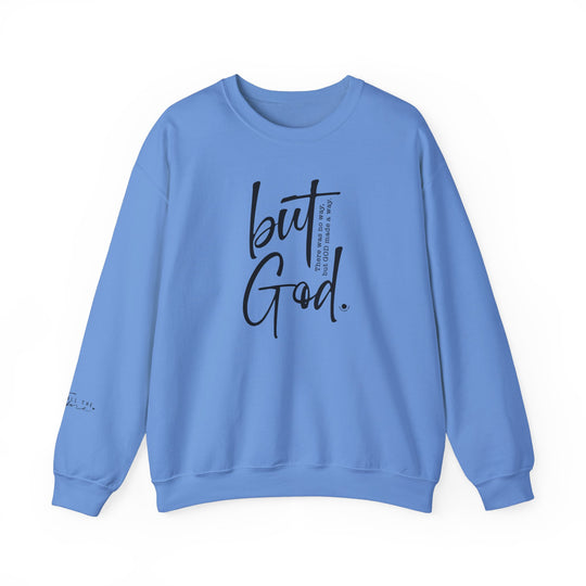 A unisex heavy blend crewneck sweatshirt featuring the 'But God Crew' design. Made of 50% cotton and 50% polyester, with ribbed knit collar and double-needle stitching for durability. Tear-away label for itch-free wear.