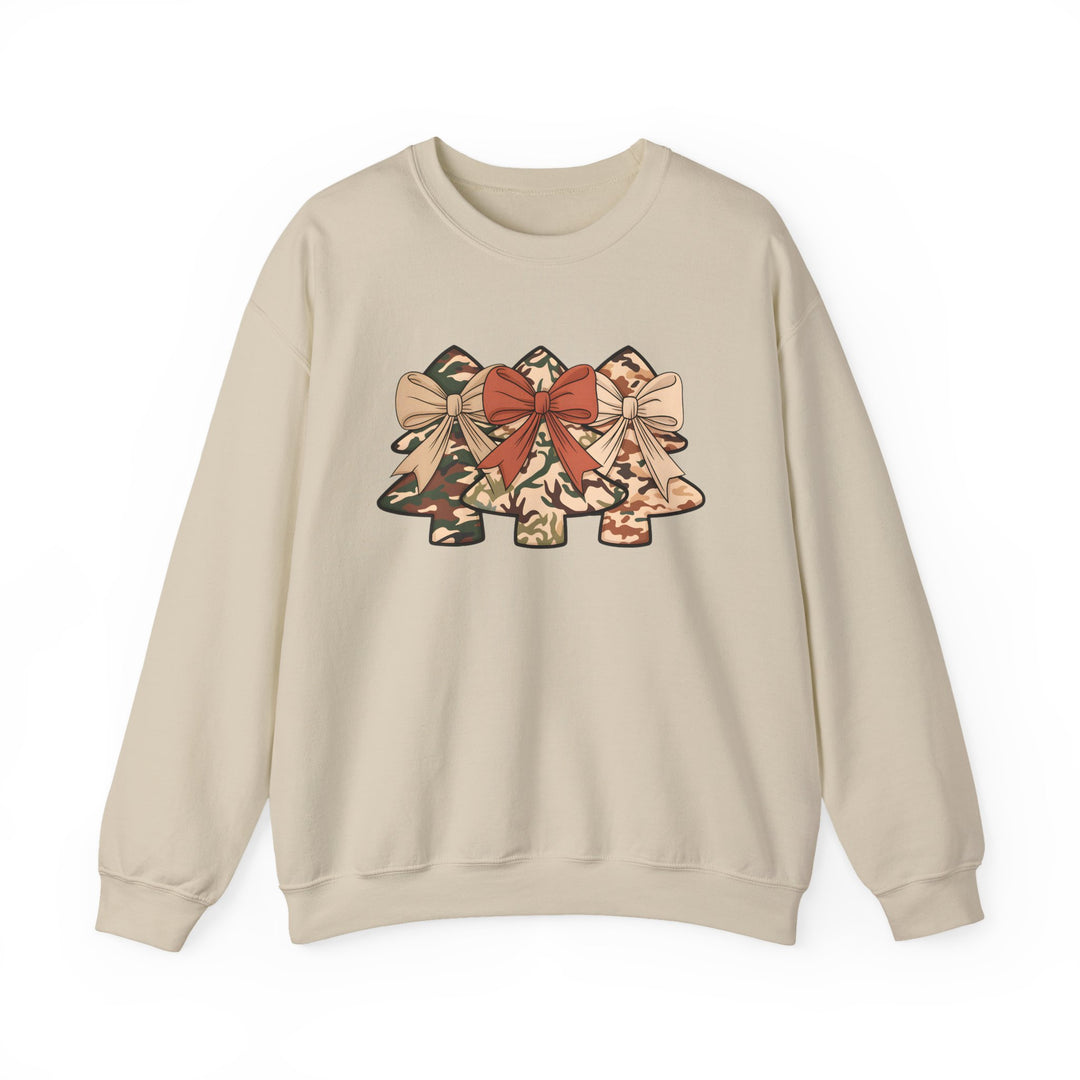 Cream crew-neck sweatshirt with camo Christmas trees graphic, each adorned with bows. Made from polyester-cotton blend for comfort and durability. Ideal for festive occasions.