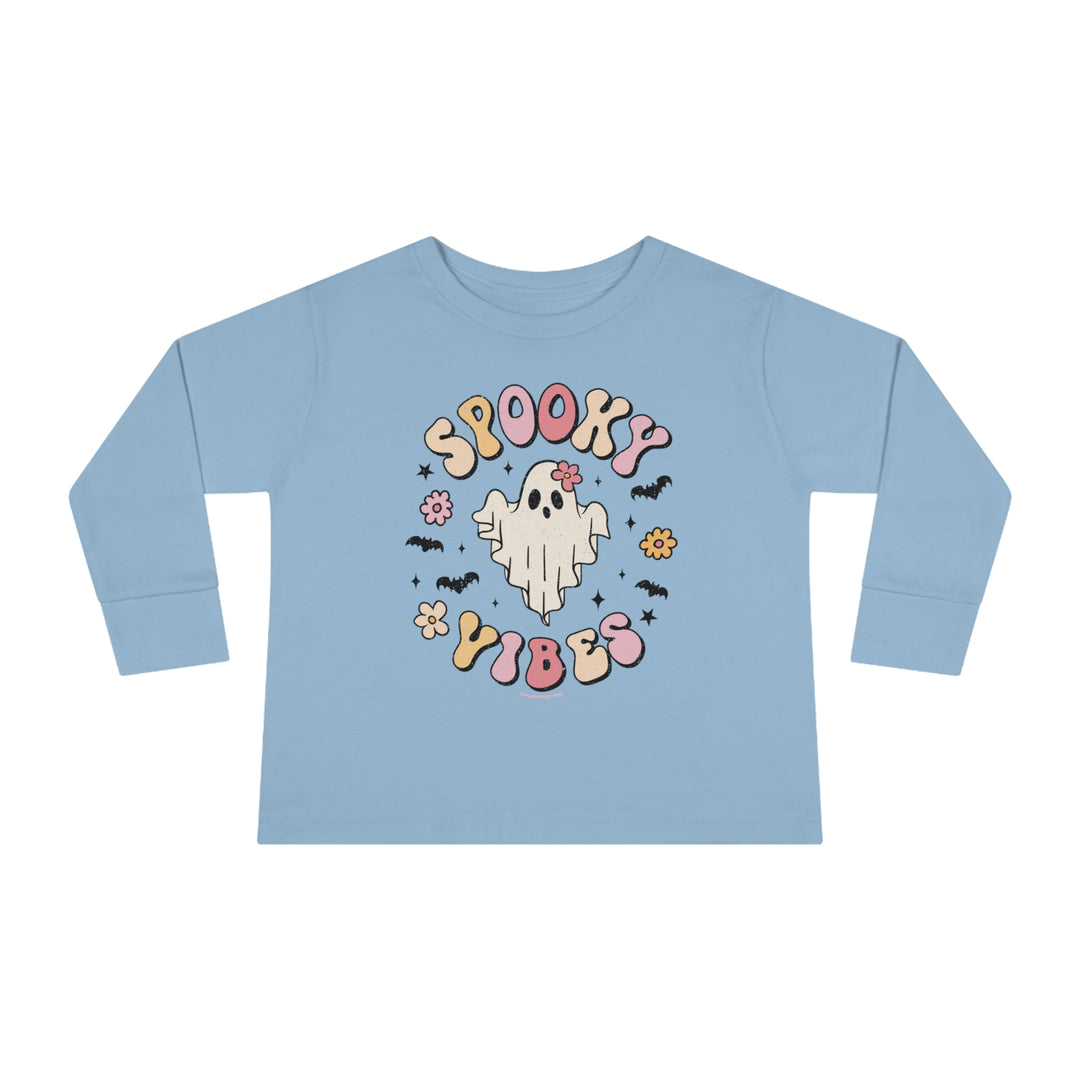 A spooky vibes toddler long sleeve tee featuring a blue shirt with a ghost and bats design. Made from 100% combed ringspun cotton, with a ribbed collar and EasyTear™ label for comfort and durability.