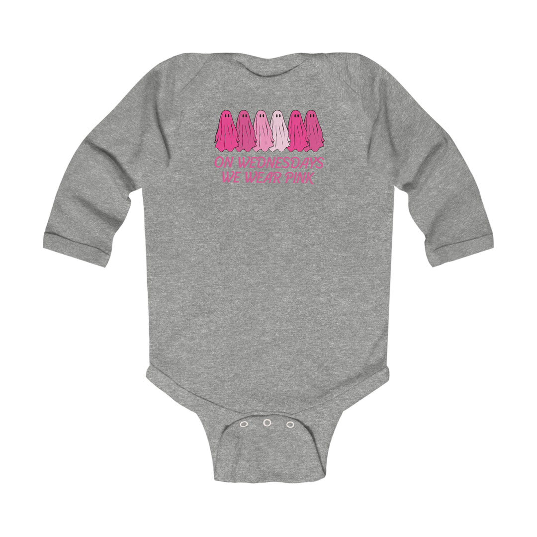 A grey baby bodysuit featuring pink and white text, ideal for infants. Made of soft, durable cotton with plastic snaps for easy changing. From 'Worlds Worst Tees'.