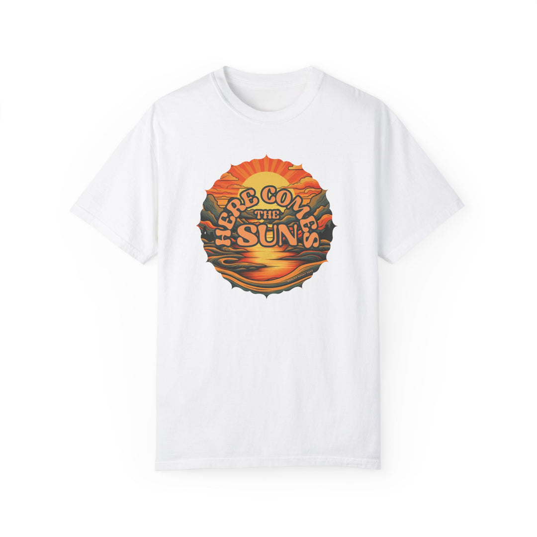 A relaxed fit Here Comes The Sun Tee, a white shirt with a graphic sunset and mountain design. 100% ring-spun cotton, double-needle stitching for durability, no side-seams for a tubular shape.