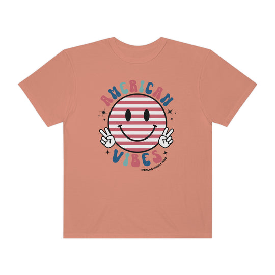 American Vibes Tee: A relaxed fit t-shirt featuring a smiley face and peace sign design. 100% ring-spun cotton, garment-dyed for extra coziness and durability. Ideal for daily wear.