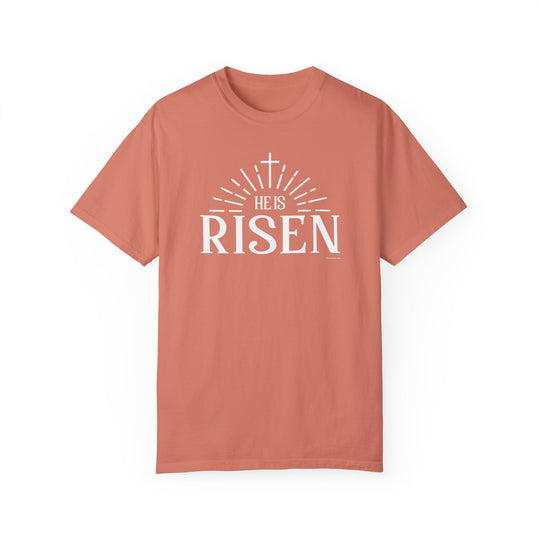 A garment-dyed He is Risen Tee, 100% ring-spun cotton, medium weight, relaxed fit, double-needle stitching, no side-seams, tubular shape, cozy and durable.