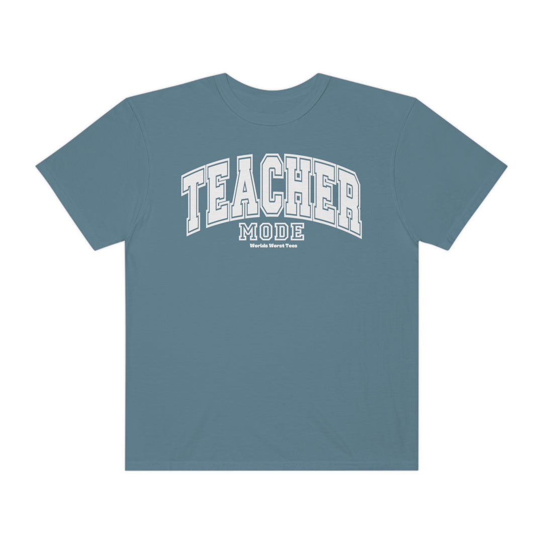 Unisex Teacher Mode Tee, a blue shirt with white text, made of 80% ring-spun cotton and 20% polyester. Features a relaxed fit, rolled-forward shoulder, and back neck patch. Sizes from S to 4XL.