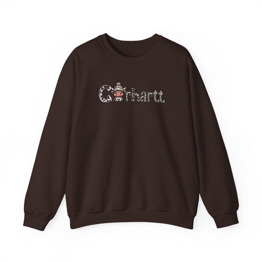 A brown Cowhartt Cow Crew sweatshirt featuring a cartoon cow with horns and a hat. Unisex heavy blend crewneck, 50% cotton, 50% polyester, ribbed knit collar, loose fit, medium-heavy fabric.
