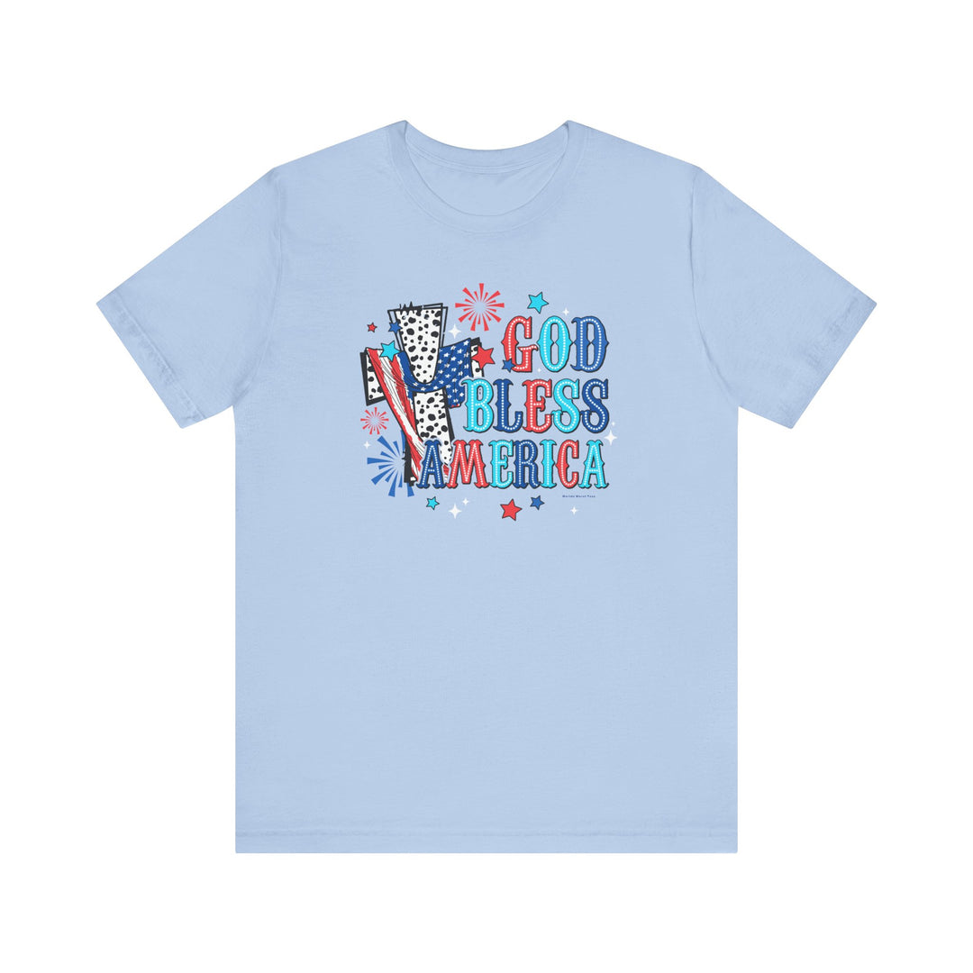 A light blue t-shirt featuring a cross with a flag and stars, embodying the title God Bless America Cross Tee from Worlds Worst Tees. Unisex jersey tee with ribbed knit collars, 100% cotton, retail fit.