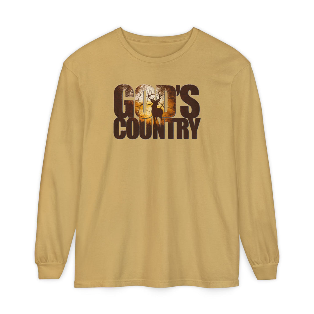 God's Country Long Sleeve Tee features GOD'S COUNTRY graphic with a sunset, trees, and stag silhouette, crafted from 100% ring-spun cotton, offering a relaxed fit.