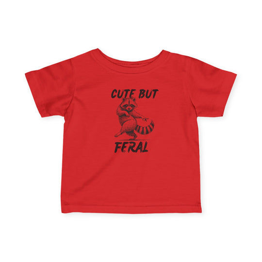 Cute but Feral Baby Tee: A bright red children's T-shirt with a raccoon illustration and slogan, emphasizing comfort and durability with soft, ring-spun cotton.