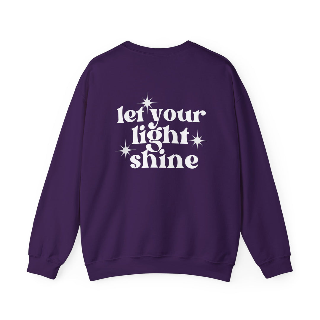 A unisex heavy blend crewneck sweatshirt featuring the Let Your Light Shine Crew design. Ribbed knit collar, polyester and cotton blend, no itchy side seams. Medium-heavy fabric, loose fit, runs true to size.