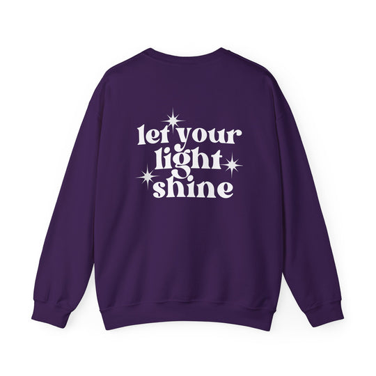 A unisex heavy blend crewneck sweatshirt featuring the Let Your Light Shine Crew design. Ribbed knit collar, polyester and cotton blend, no itchy side seams. Medium-heavy fabric, loose fit, runs true to size.