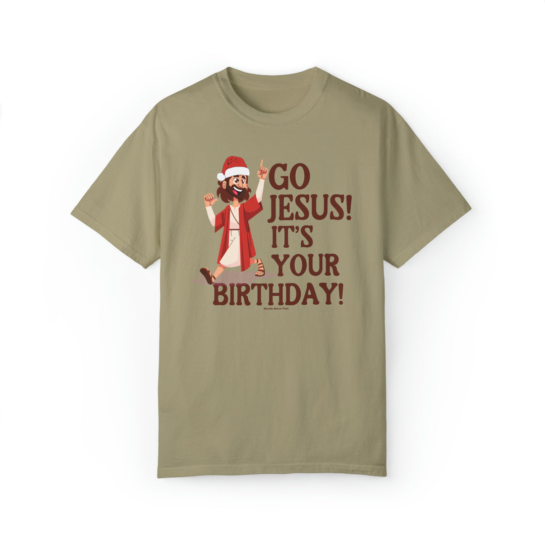 Unisex Go Jesus it's your birthday Tee, featuring a cartoon character holding his thumb up on a tan shirt. Made of 80% ring-spun cotton and 20% polyester, with a relaxed fit and rolled-forward shoulder.