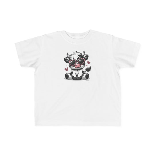 Cute Cow Toddler Tee: A white t-shirt featuring a cartoon cow in heart-shaped sunglasses, perfect for sensitive skin. 100% combed ringspun cotton, light fabric, tear-away label, classic fit. Sizes: 2T, 3T, 4T, 5-6T.
