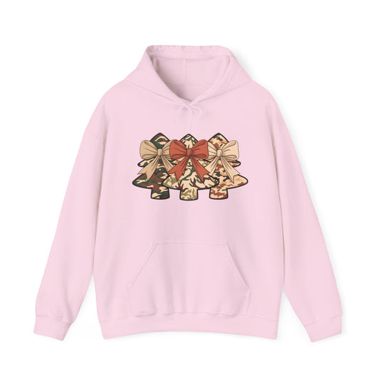 Camo Christmas Tree Hoodie featuring three camo-patterned Christmas trees with bows, light pink pullover design, kangaroo pocket, and drawstring hood. Ideal for casual, festive wear.