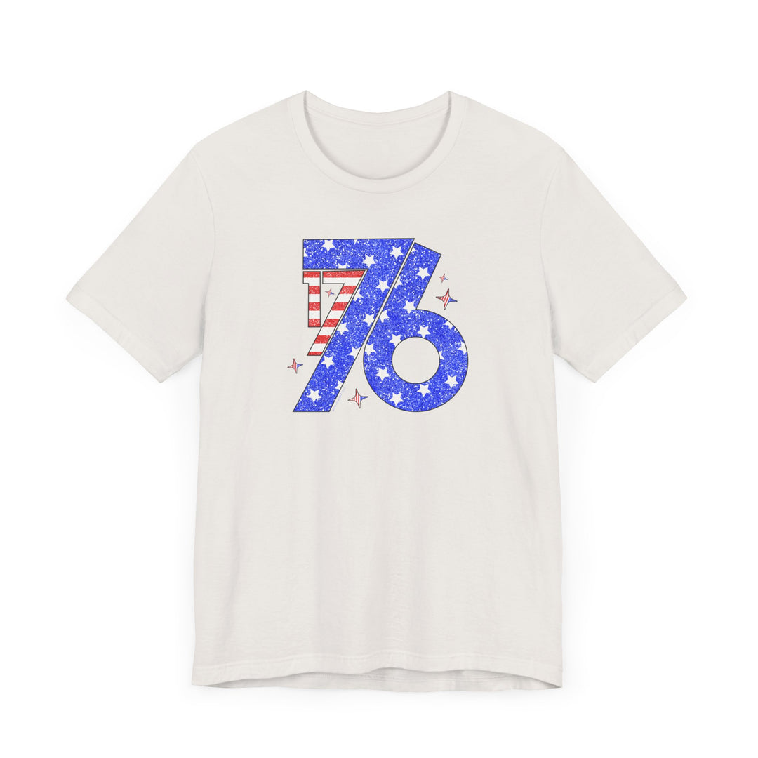 A classic 1776 Tee: white shirt with blue and red design, stars, and stripes. Unisex jersey tee, 100% cotton, light fabric, retail fit, tear away label. Sizes XS-3XL.