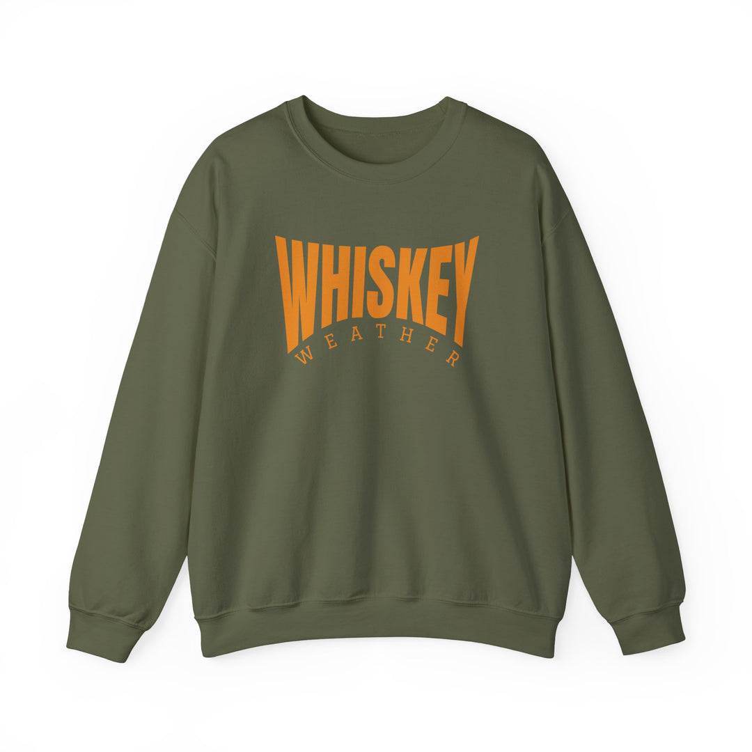 Olive-green crewneck sweatshirt featuring bold orange WHISKEY WEATHER text across the chest; unisex, cozy fit with ribbed cuffs and waistband.