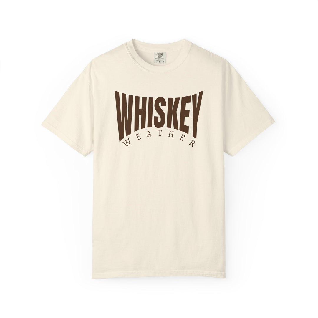 Cream-colored T-shirt with WHISKEY WEATHER printed on chest, featuring short sleeves and a relaxed fit for casual comfort.