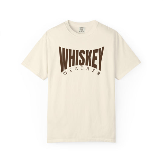 Cream-colored T-shirt with WHISKEY WEATHER printed on chest, featuring short sleeves and a relaxed fit for casual comfort.