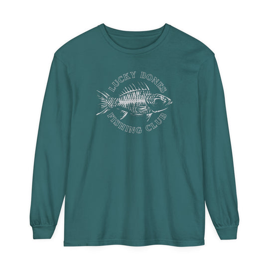A Lucky Bones Fishing Club Long Sleeve Tee featuring a fish graphic on green fabric. Made of 100% ring-spun cotton, garment-dyed, with a relaxed fit for ultimate comfort. Ideal for casual settings.