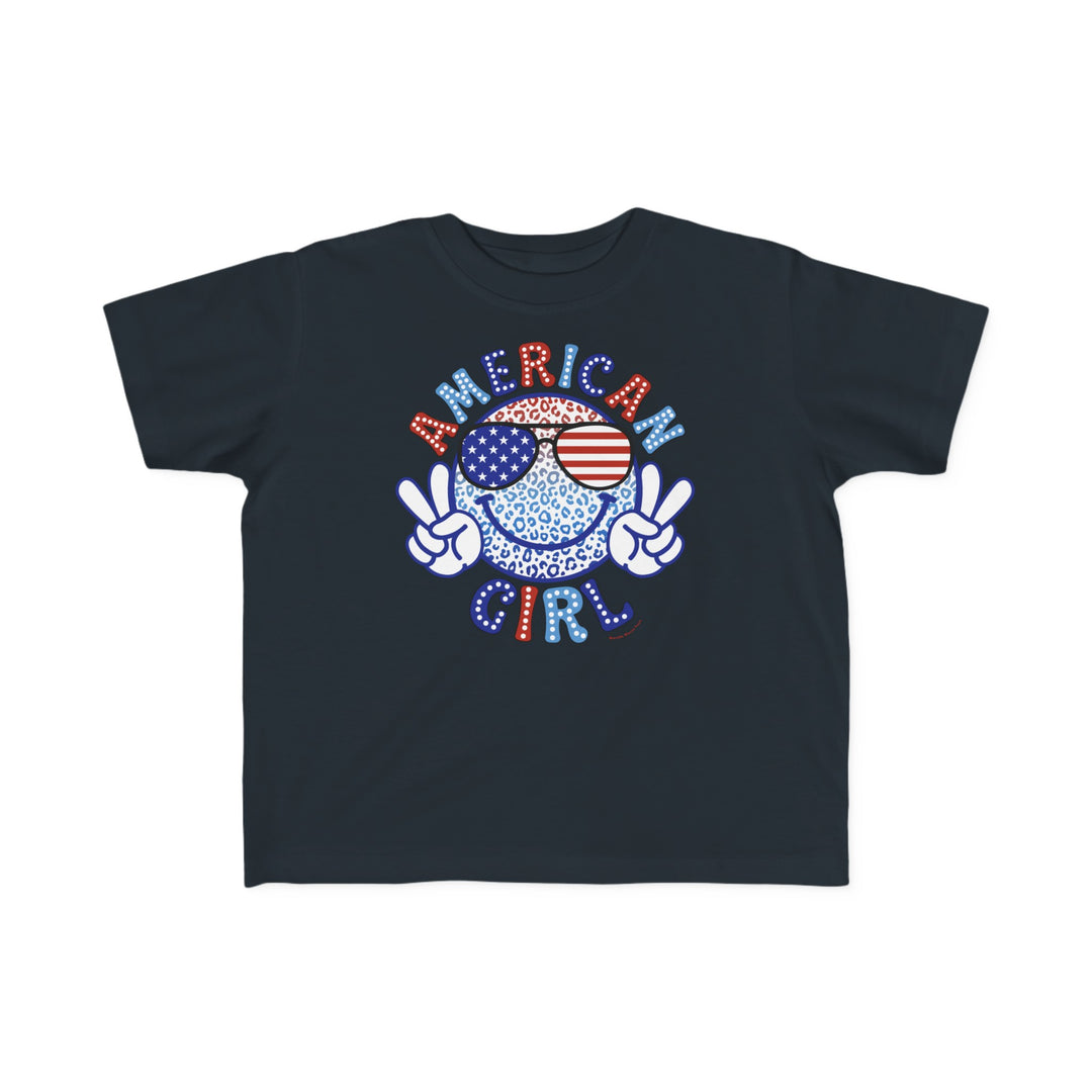 American Girl Toddler Tee featuring a cartoon character with sunglasses, peace sign hand gestures, and a smile. Soft 100% combed ringspun cotton, light fabric, tear-away label, and classic fit. Sizes: 2T, 3T, 4T, 5-6T.