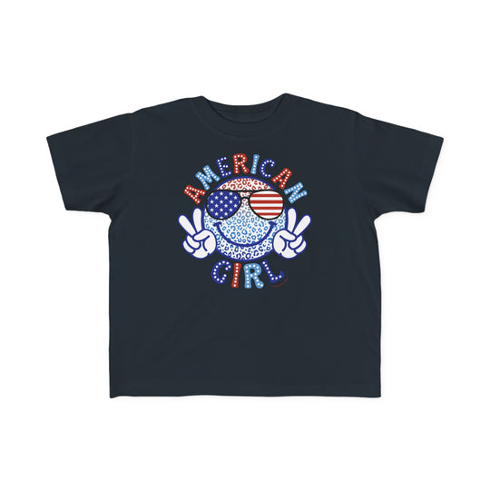 American Girl Toddler Tee featuring a cartoon character with sunglasses, peace sign hand gestures, and a smile. Soft 100% combed ringspun cotton, light fabric, tear-away label, and classic fit. Sizes: 2T, 3T, 4T, 5-6T.