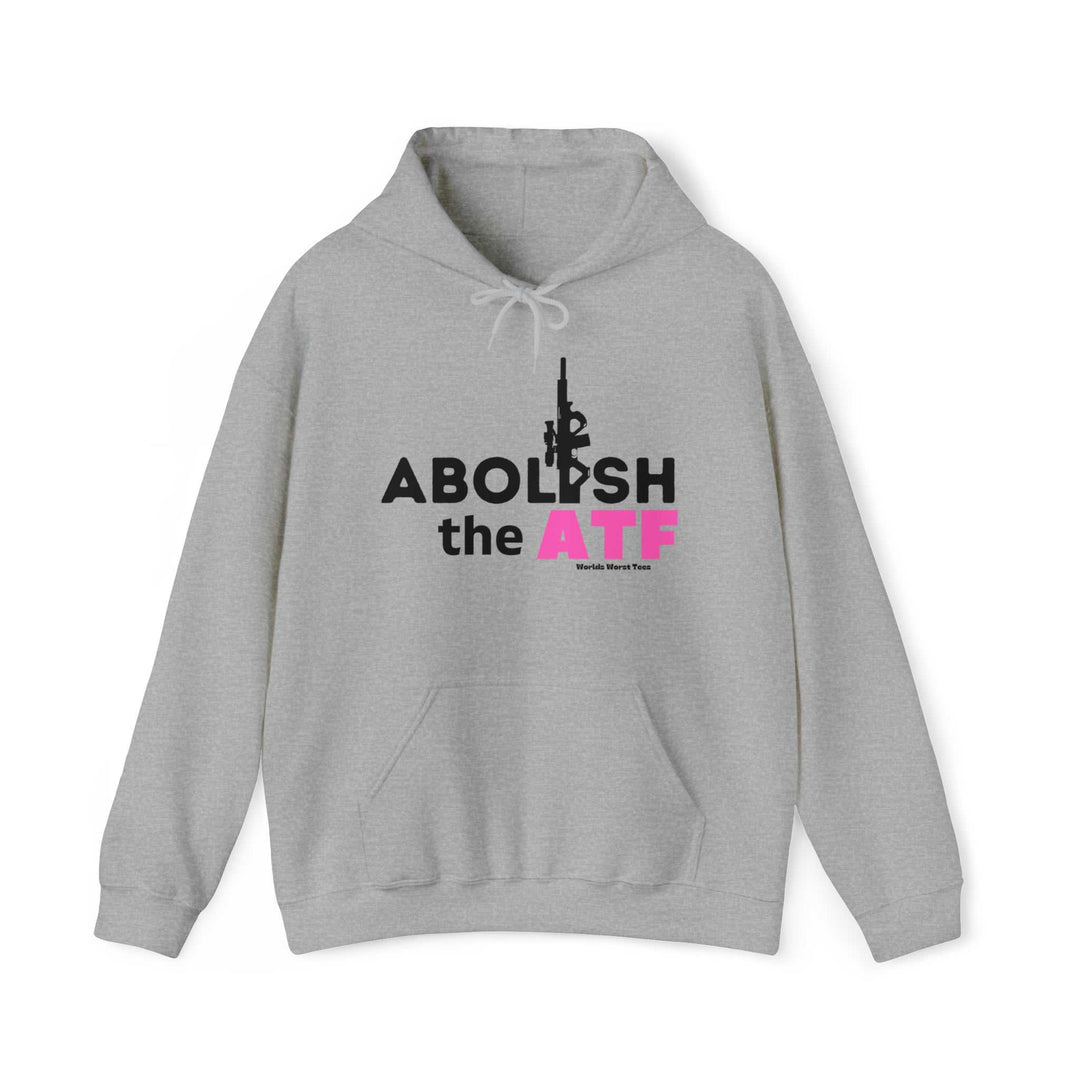 Unisex Abolish the ATF Hoodie: A grey sweatshirt with bold black and pink text, featuring a kangaroo pocket and drawstring hood. Made of 50% cotton and 50% polyester, offering a cozy, printed surface. Classic fit, tear-away label.