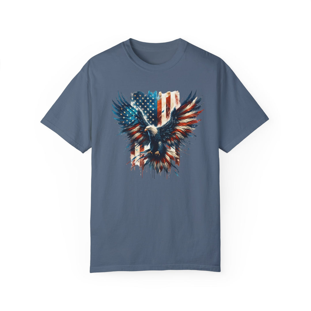 A relaxed fit American Eagle Tee, featuring a patriotic design of an eagle and flag on a blue shirt. Made of 100% ring-spun cotton, with double-needle stitching for durability and a soft-washed finish for extra coziness.