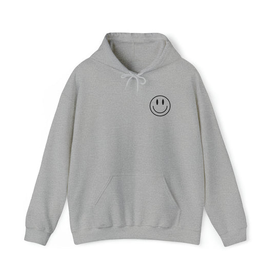 A heavy blend hooded sweatshirt featuring a smiley face design. Unisex, 50% cotton, 50% polyester, with kangaroo pocket and drawstring hood. Title: GOOD DAY TO HAVE A GOOD DAY.